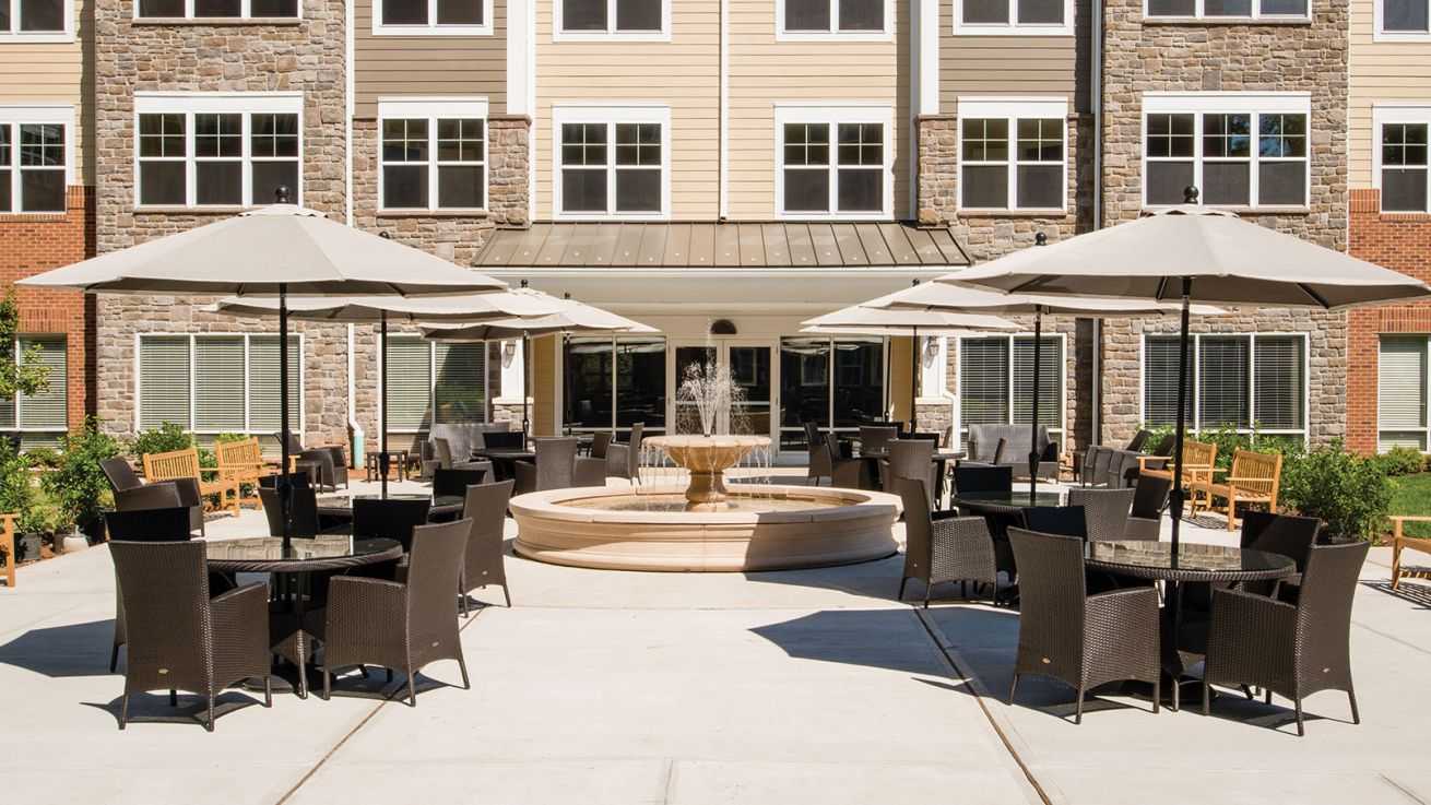 tables and chairs outside of building