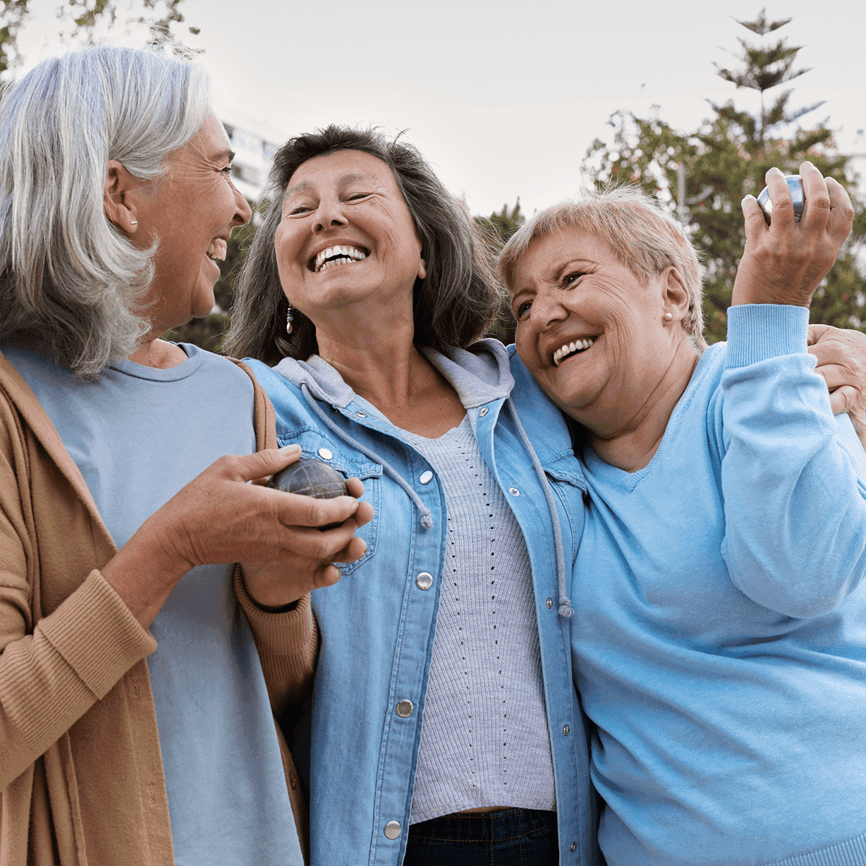 3 senior ladies smiling together