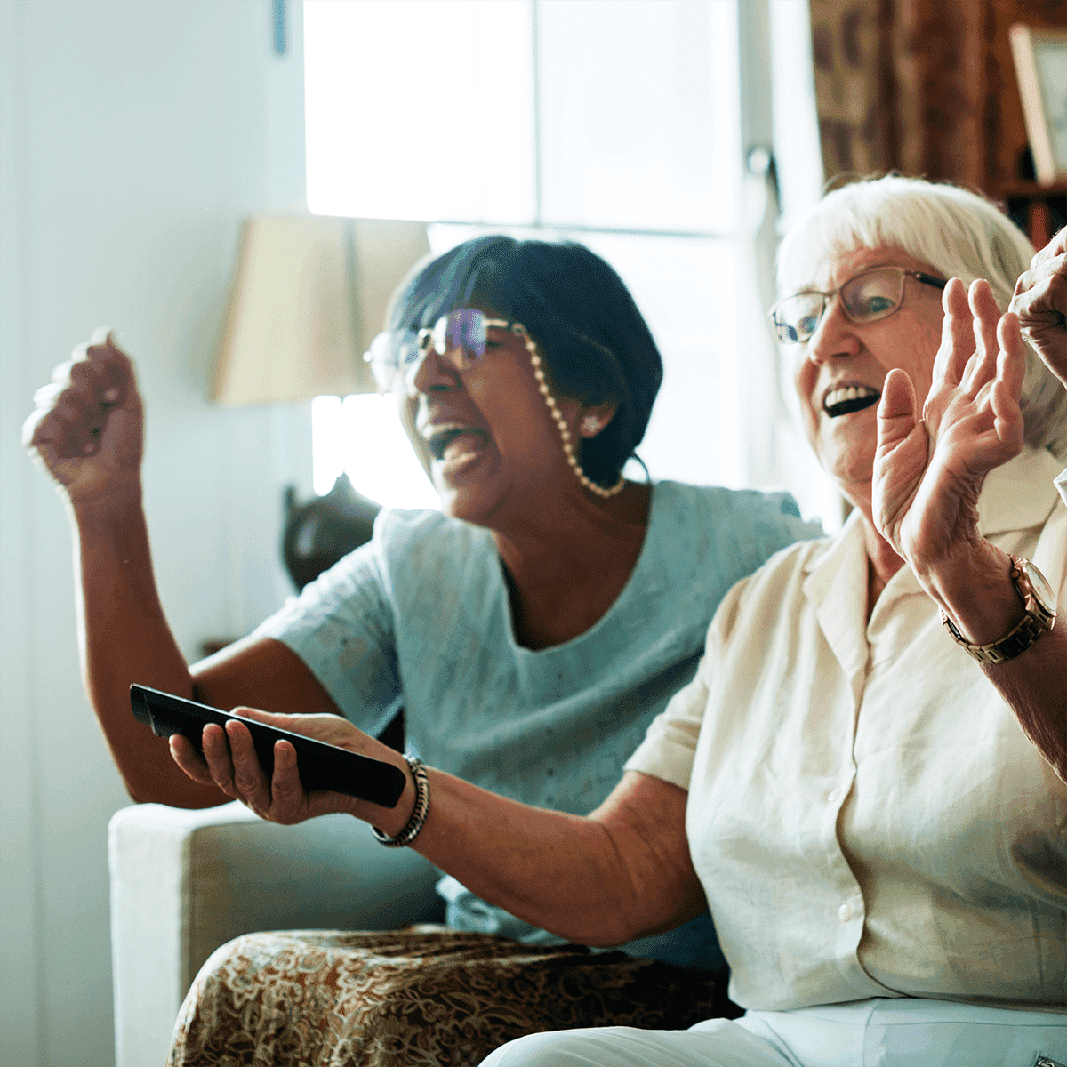 Pair of elder ladies watching tv