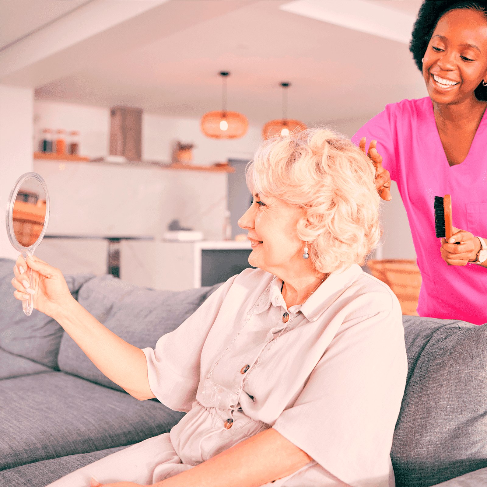 nurse brushing the hair of a smiling senior woman