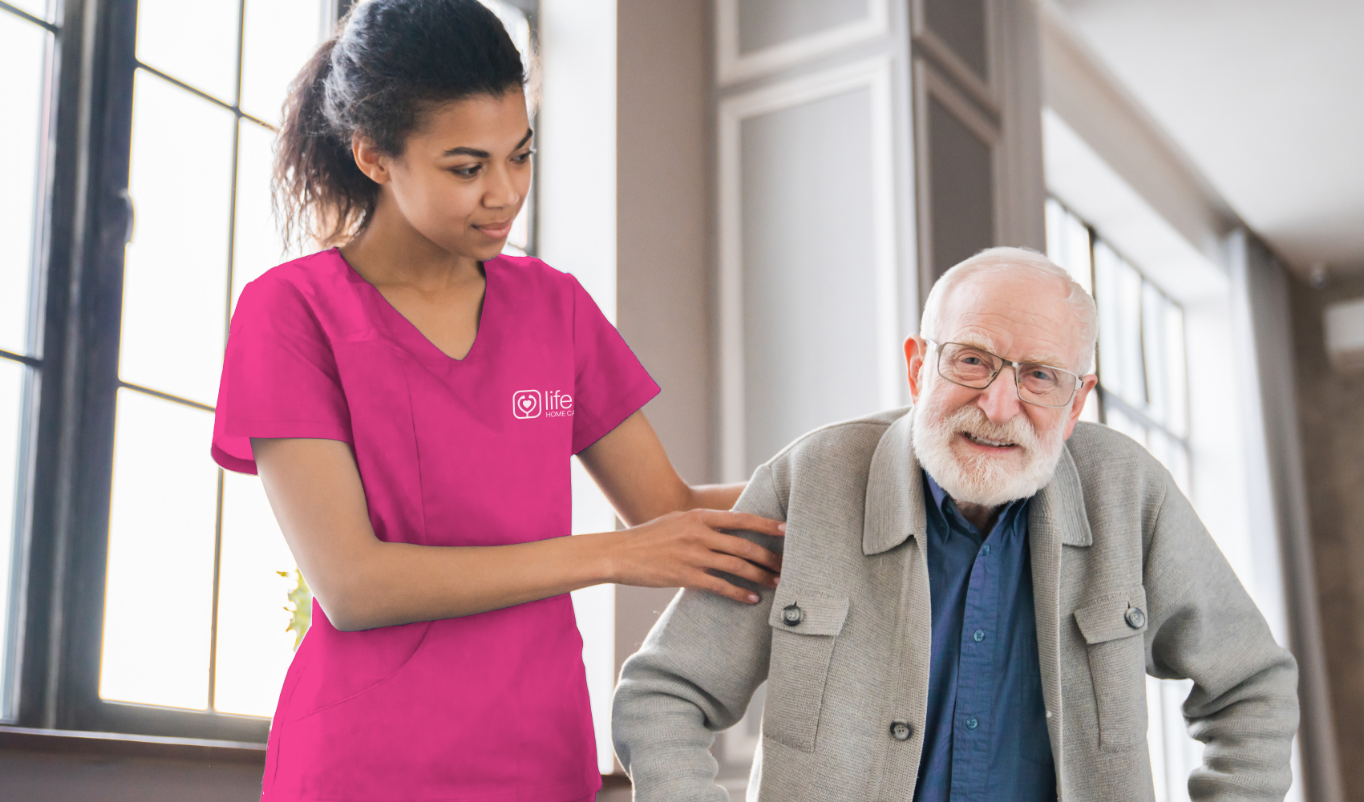 A nurse walking with her patient