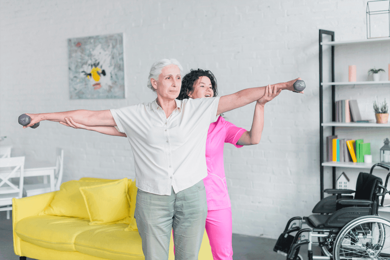 caregiver helping senior lady with exercise