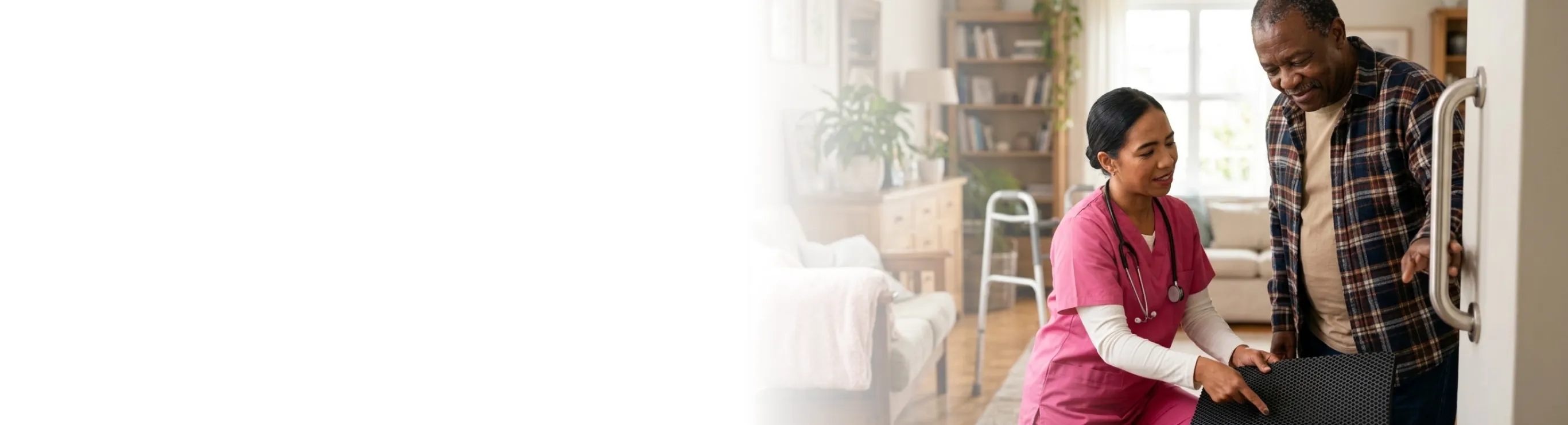 caregiver assisting a senior to safely walk across a room
